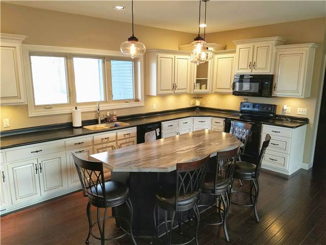 Painted and glazed perimeter cabinets - stained island - laminate countertops